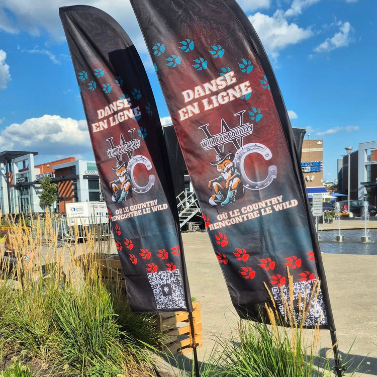 Wild Fox Country beach flags set up at Centropolis, marking the entrance of the country event with bright colors and festive branding.